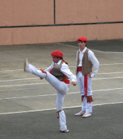 Basque dancer doing a high kick.