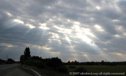 Sun rays  a brooding sky over the A62 autoroute.