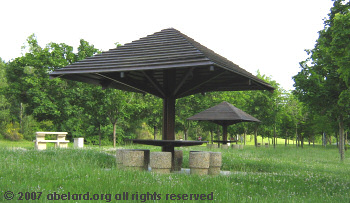 Picnic tables in the shade, and not