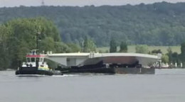 Transporting one of the roadways up the Seine.