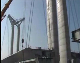 Attaching the cables between 'butterfly' head and roadway.