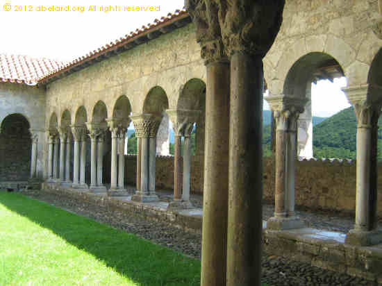 The Romanesque cloisters overlook the lower slopes of the Pyrenees