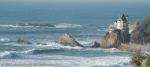 The coast at Biarritz, with a distant Virgin of the Rock.