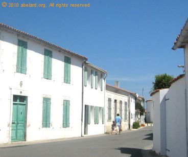 whitewashed, sun-drenched street in Ile de Re;