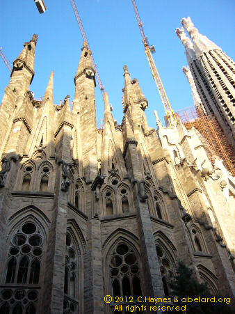 Spires of Sagrada Familia with cranes.