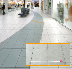 Tiles in a shopping precinct. Insert shows measuring tile width/length.
